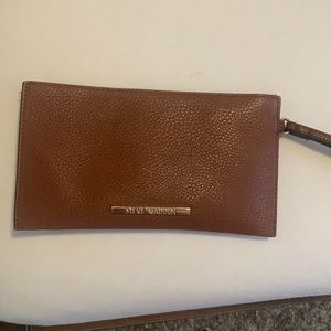 Brown Steve Madden wristlet with handle gold logo